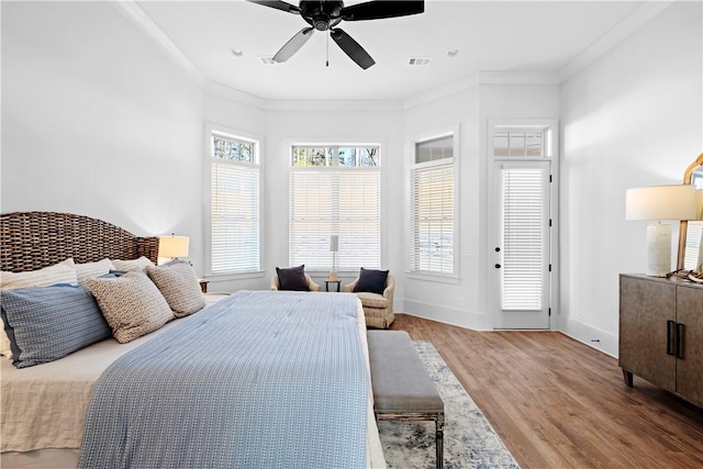 124 Merlin St, Opelika, AL 36801 - bedroom with wood finished floors, crown molding, and a ceiling fan