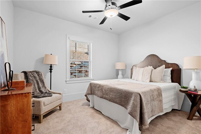 124 Merlin St, Opelika, AL 36801 - bedroom with light colored carpet and ceiling fan