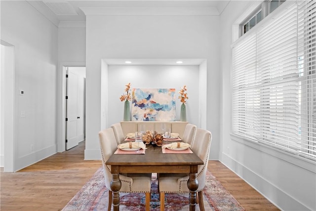 124 Merlin St, Opelika, AL 36801 - dining space with light wood-style flooring, ornamental molding, and recessed lighting