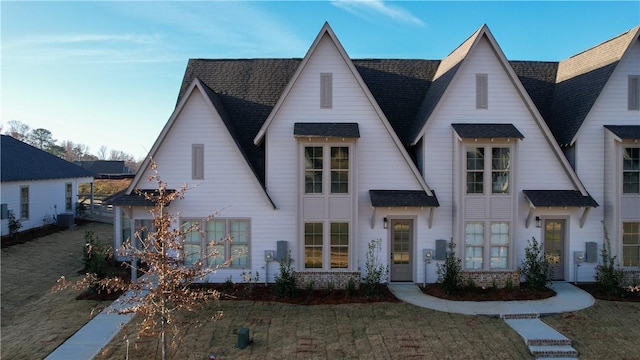 modern farmhouse style home with a front lawn