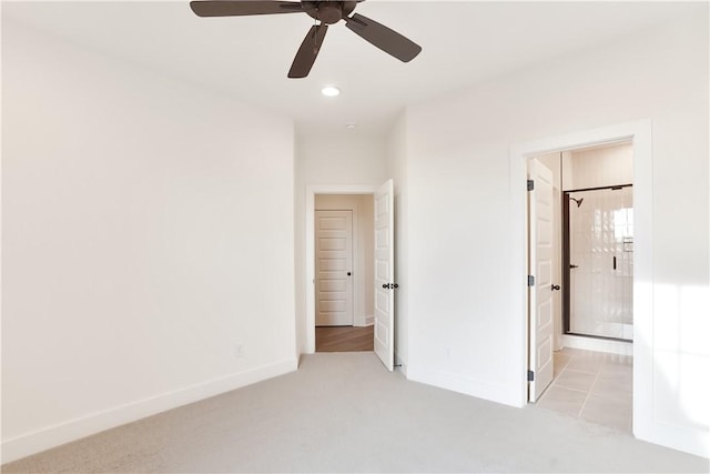 unfurnished bedroom with light carpet and ceiling fan