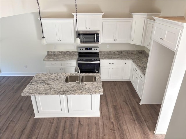 kitchen with pendant lighting, white cabinets, sink, light stone countertops, and stainless steel appliances