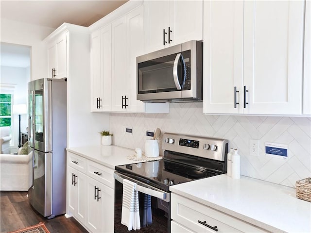 1021 Crossing Ct E, Valley, AL 36854 - kitchen with appliances with stainless steel finishes, light countertops, white cabinetry, and dark wood-style flooring