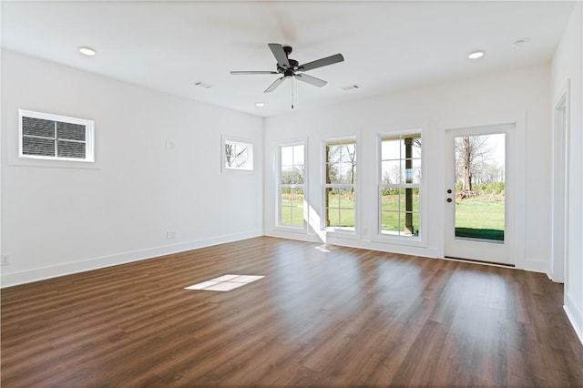 1021 Crossing Ct E, Valley, AL 36854 - empty room with healthy amount of natural light, dark wood-style floors, a ceiling fan, and recessed lighting