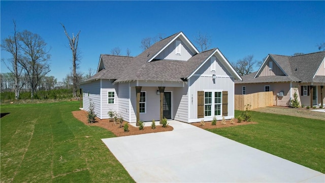 1021 Crossing Ct E, Valley, AL 36854 - view of front facade with board and batten siding, roof with shingles, and driveway