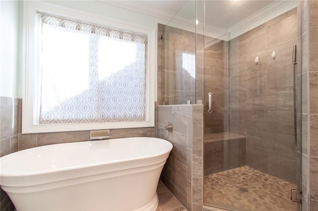 bathroom featuring tile patterned floors, a wealth of natural light, crown molding, and independent shower and bath