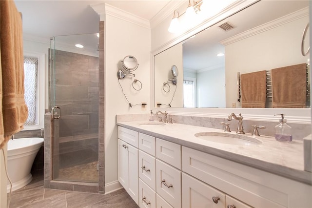 bathroom featuring vanity, ornamental molding, and shower with separate bathtub