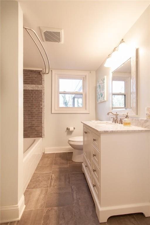 full bathroom featuring bathtub / shower combination, vanity, and toilet