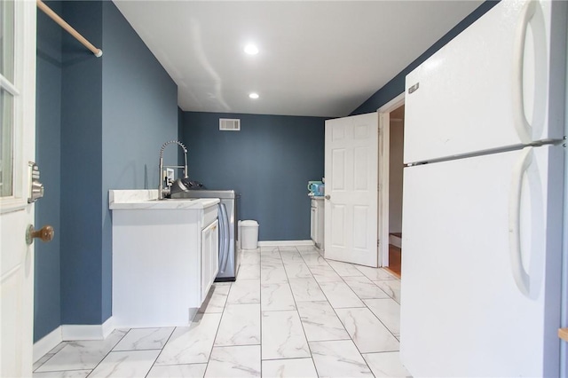 clothes washing area featuring washer / clothes dryer