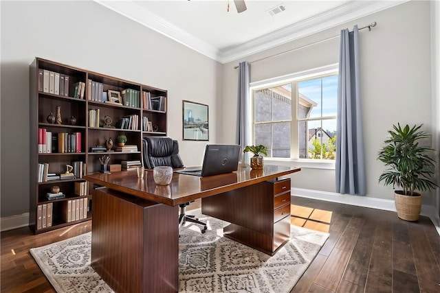 office space featuring baseboards, visible vents, a ceiling fan, ornamental molding, and dark wood-style flooring