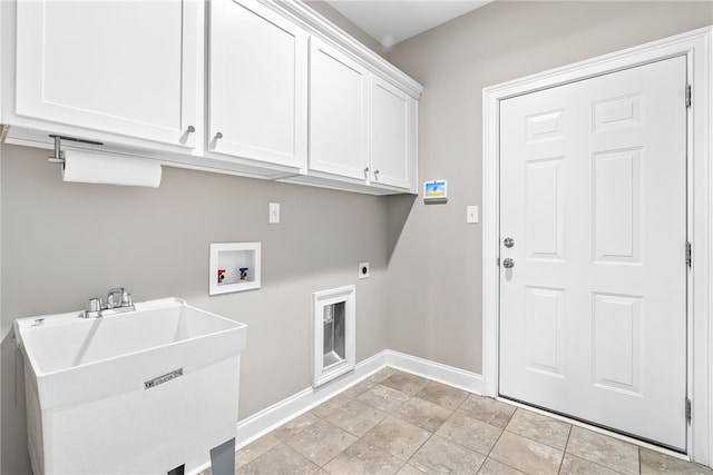 washroom featuring washer hookup, cabinet space, hookup for an electric dryer, a sink, and baseboards