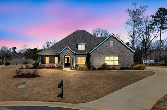 view of front facade featuring brick siding