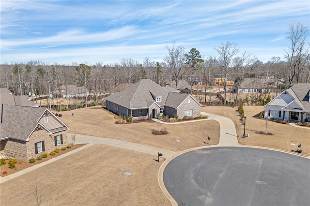 birds eye view of property with a residential view