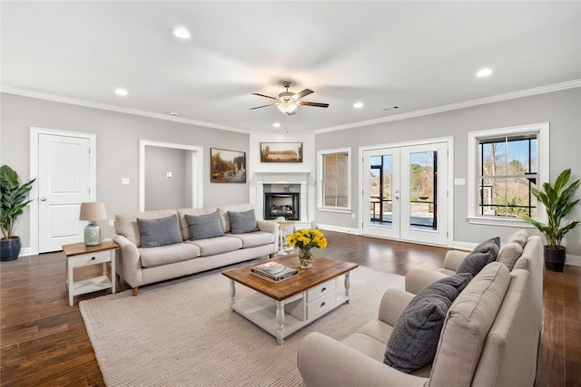 living area with crown molding, dark wood-style flooring, and recessed lighting