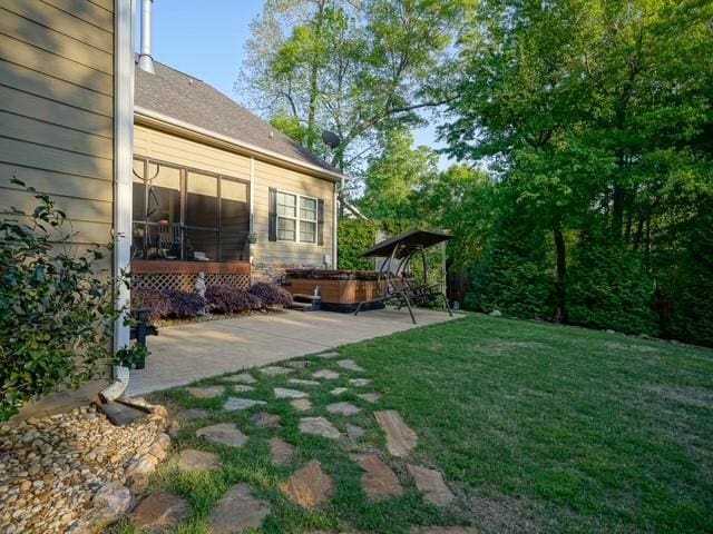 1201 Live Oak Cir, Opelika, AL 36801 - view of green lawn featuring a patio and a hot tub