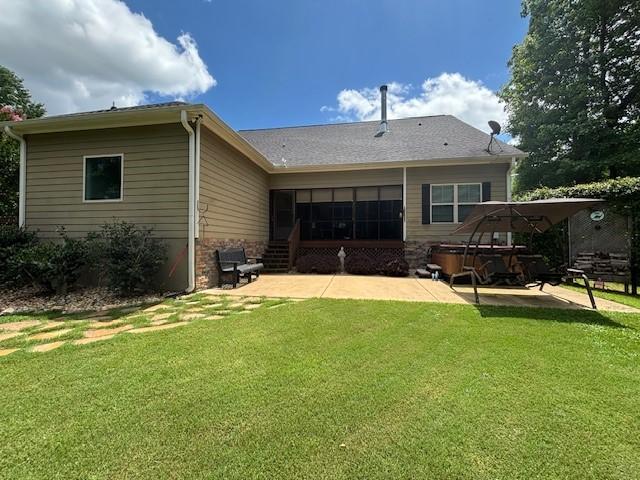 1201 Live Oak Cir, Opelika, AL 36801 - back of house featuring a yard and a patio area