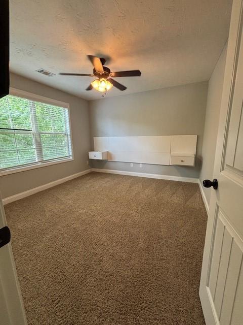 1201 Live Oak Cir, Opelika, AL 36801 - carpeted spare room featuring a ceiling fan and baseboards