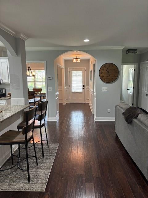 1201 Live Oak Cir, Opelika, AL 36801 - entryway featuring arched walkways, dark wood finished floors, ornamental molding, and recessed lighting