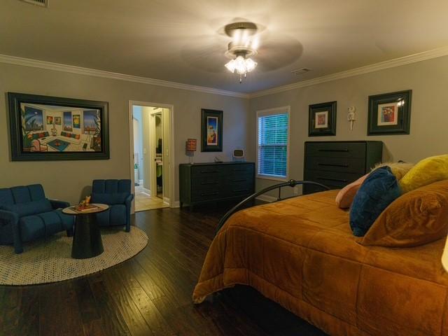 1201 Live Oak Cir, Opelika, AL 36801 - bedroom featuring wood finished floors, crown molding, and baseboards