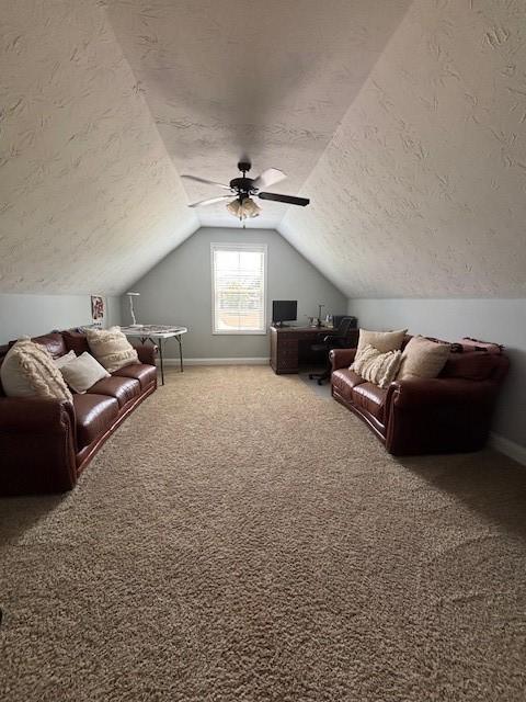 1201 Live Oak Cir, Opelika, AL 36801 - carpeted living room with a textured ceiling, vaulted ceiling, and ceiling fan