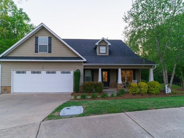 1201 Live Oak Cir, Opelika, AL 36801 - craftsman house with covered porch, concrete driveway, and roof with shingles