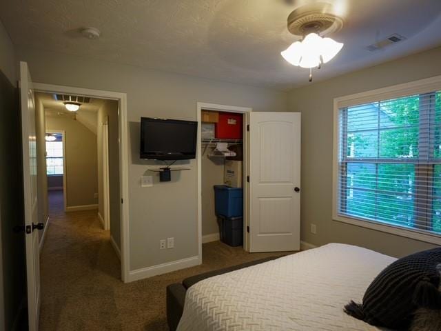 1201 Live Oak Cir, Opelika, AL 36801 - carpeted bedroom featuring baseboards, a closet, and a spacious closet
