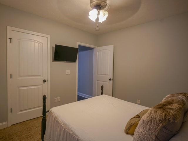 1201 Live Oak Cir, Opelika, AL 36801 - carpeted bedroom with a ceiling fan and baseboards