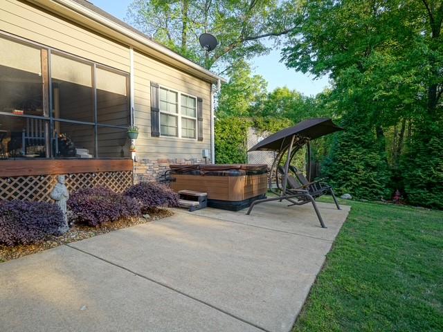 1201 Live Oak Cir, Opelika, AL 36801 - view of patio / terrace with a hot tub