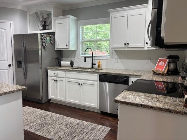 1201 Live Oak Cir, Opelika, AL 36801 - kitchen with appliances with stainless steel finishes, ornamental molding, dark wood-style flooring, white cabinets, and light stone countertops