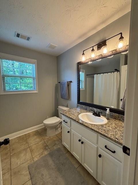 1201 Live Oak Cir, Opelika, AL 36801 - full bathroom with vanity, tile patterned floors, a textured ceiling, and a shower with shower curtain