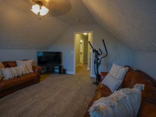 1201 Live Oak Cir, Opelika, AL 36801 - carpeted living area featuring lofted ceiling, a ceiling fan, and baseboards