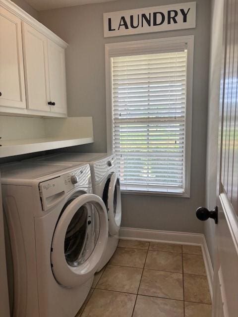 1201 Live Oak Cir, Opelika, AL 36801 - washroom with cabinet space, washer and dryer, and light tile patterned floors