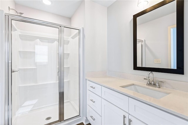 bathroom featuring vanity and walk in shower