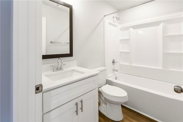 full bathroom featuring shower / tub combination, hardwood / wood-style floors, vanity, and toilet