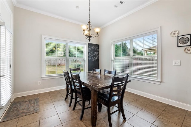 dining room with plenty of natural light, ornamental molding, tile patterned floors, and visible vents