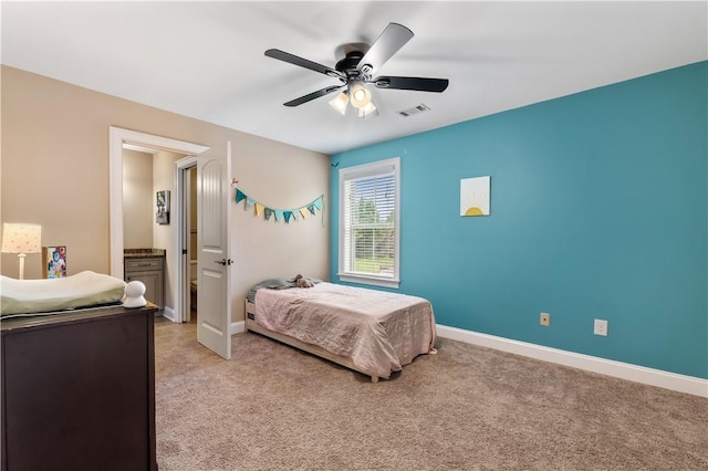 bedroom featuring visible vents, a ceiling fan, baseboards, and light colored carpet