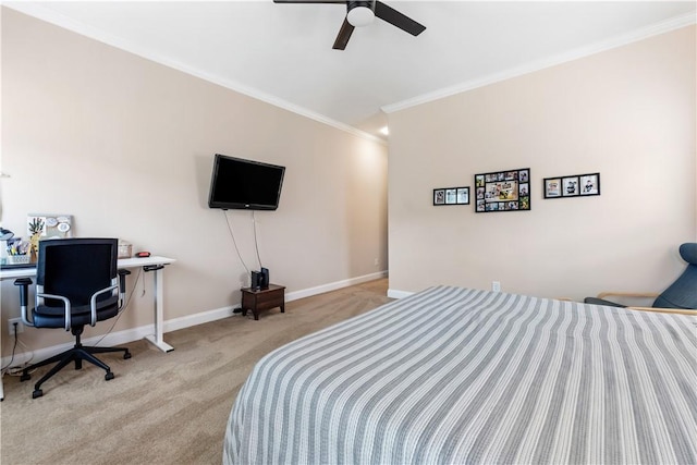 bedroom featuring baseboards, ornamental molding, carpet, and a ceiling fan