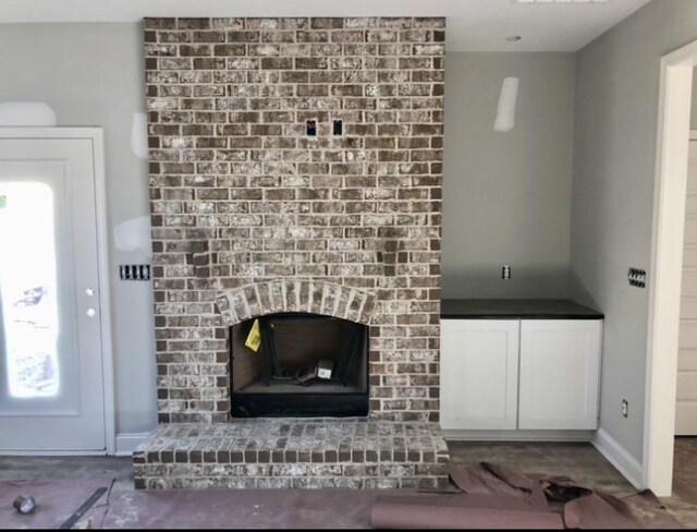 unfurnished living room with a fireplace