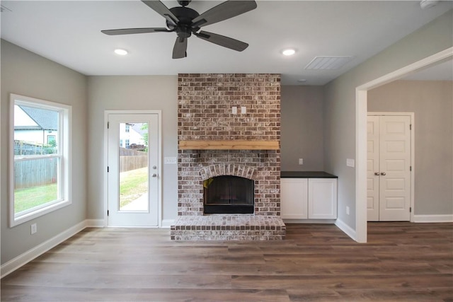 363 Lightness Dr, Auburn, AL 36832 - unfurnished living room featuring baseboards, wood finished floors, and a wealth of natural light