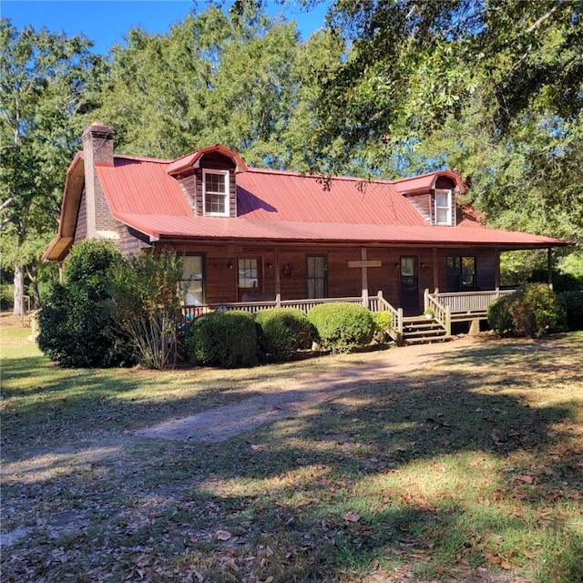 view of front facade with a porch and a front lawn