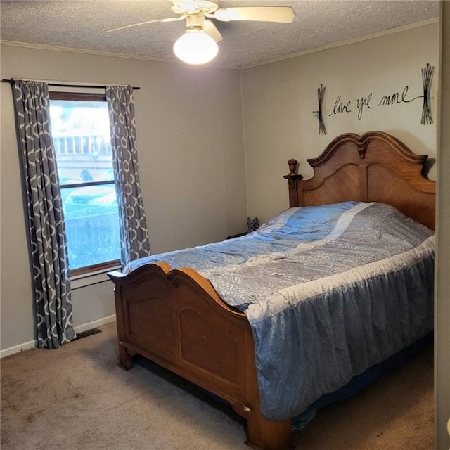 carpeted bedroom featuring ceiling fan, crown molding, and a textured ceiling