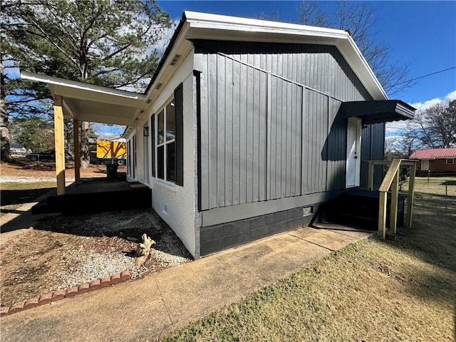 view of side of home featuring crawl space