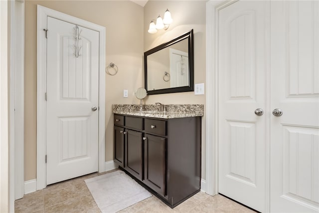1107 Hampstead Ln, Opelika, AL 36801 - bathroom featuring vanity, baseboards, and tile patterned floors