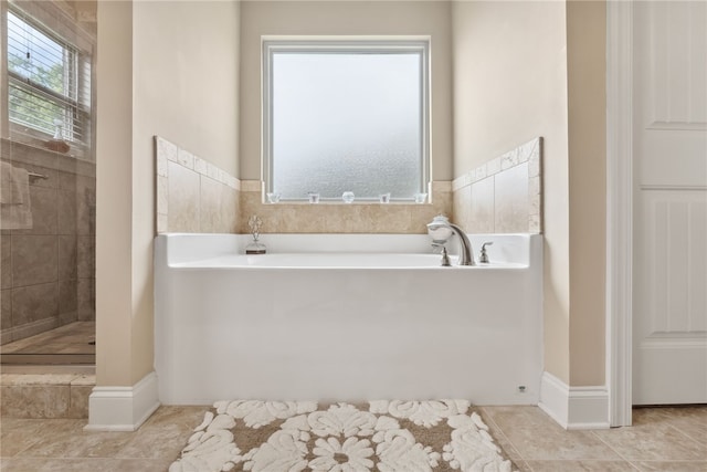 1107 Hampstead Ln, Opelika, AL 36801 - full bathroom featuring a garden tub, tiled shower, and tile patterned floors