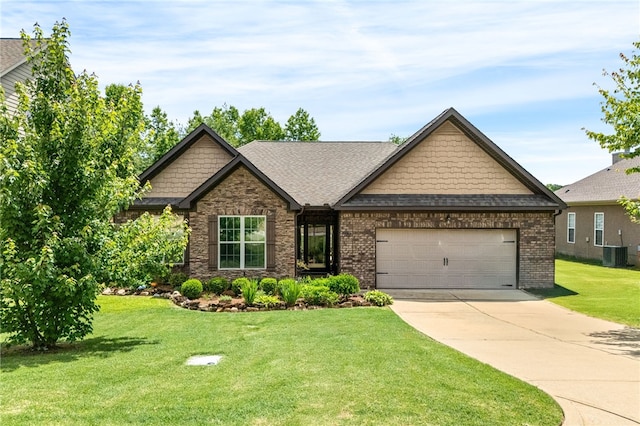 1107 Hampstead Ln, Opelika, AL 36801 - craftsman-style home featuring cooling unit, concrete driveway, a garage, a front yard, and roof with shingles