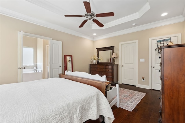 1107 Hampstead Ln, Opelika, AL 36801 - bedroom with ornamental molding, dark wood-style flooring, recessed lighting, a tray ceiling, and connected bathroom