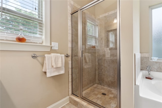 1107 Hampstead Ln, Opelika, AL 36801 - full bath with plenty of natural light, a bath, and a stall shower