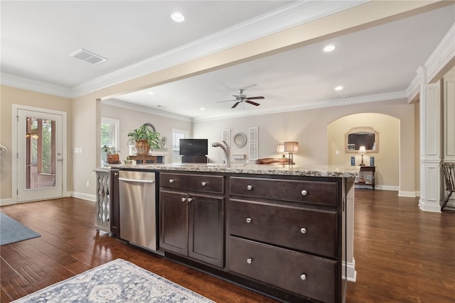 1107 Hampstead Ln, Opelika, AL 36801 - kitchen with stainless steel dishwasher, dark brown cabinetry, arched walkways, open floor plan, and a ceiling fan