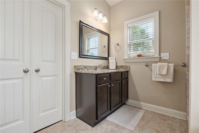 1107 Hampstead Ln, Opelika, AL 36801 - full bathroom featuring vanity, baseboards, and tile patterned floors