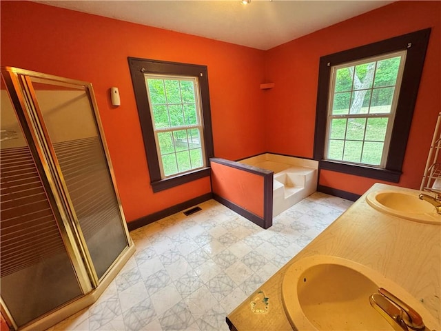 202 E Railroad St, Valley, AL 36854 - bathroom featuring baseboards, healthy amount of natural light, and a shower stall